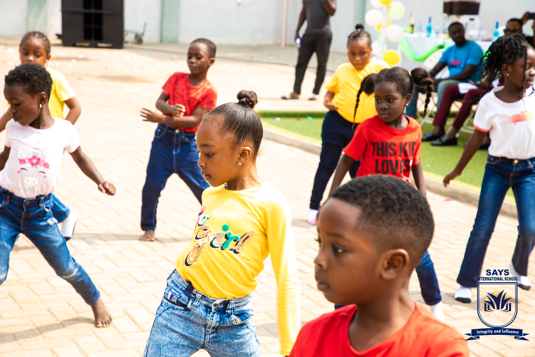 Grade one pupils performing on stage