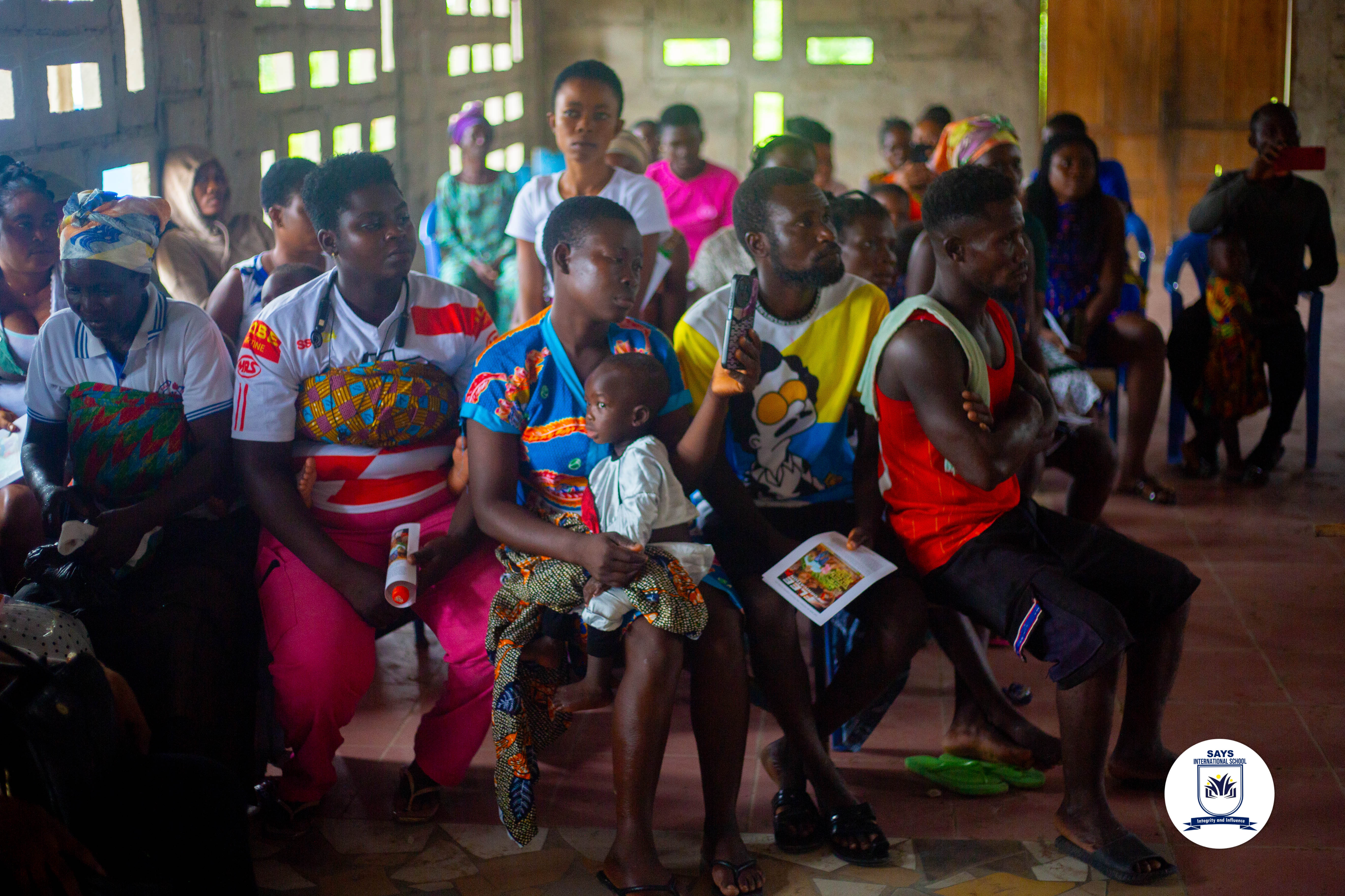 Children and volunteers gathered during an outreach