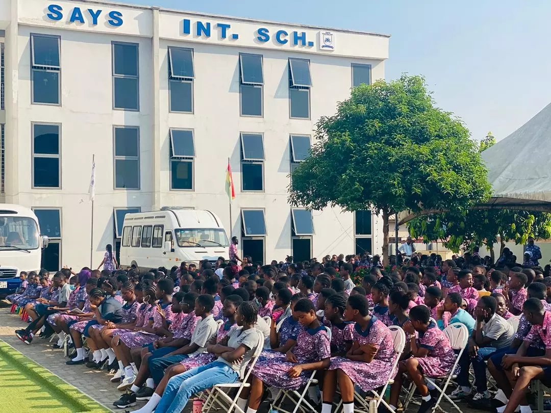 Pupils outside the school building